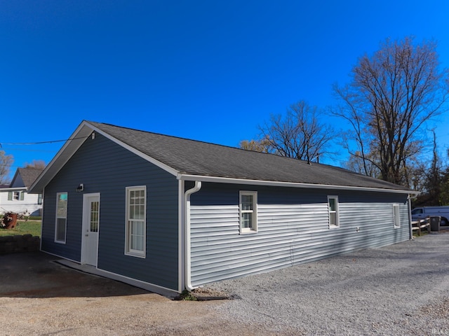 1660 W 8th St, Bloomington, IN 47404 - view of side of property featuring a shingled roof