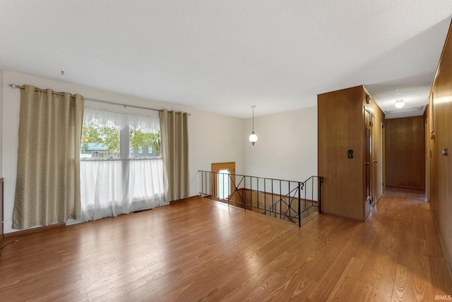 spare room featuring wood finished floors