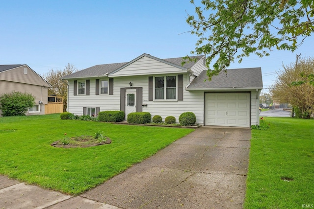 view of front of home with an attached garage, a front lawn, a shingled roof, and driveway