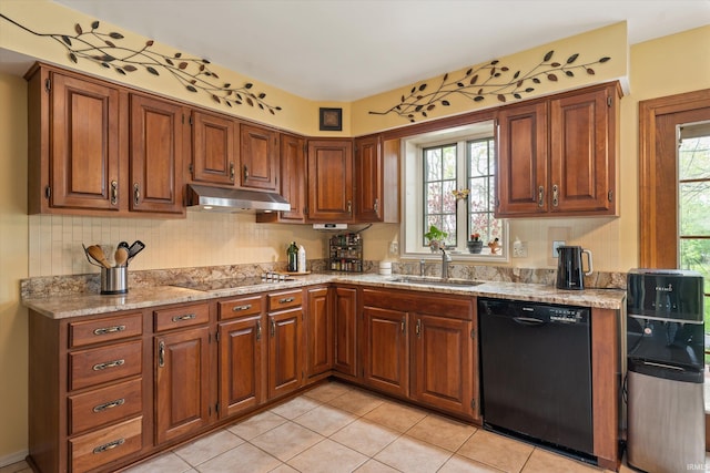 kitchen featuring black appliances, a sink, under cabinet range hood, decorative backsplash, and light tile patterned floors