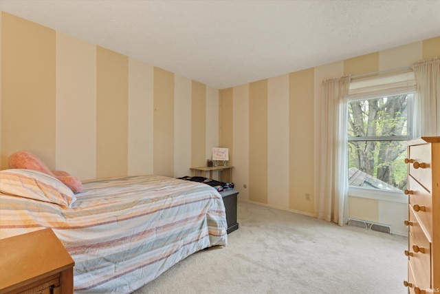 carpeted bedroom with baseboards and wallpapered walls