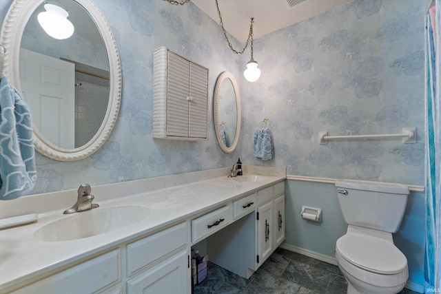 full bath with toilet, baseboards, wallpapered walls, and double vanity