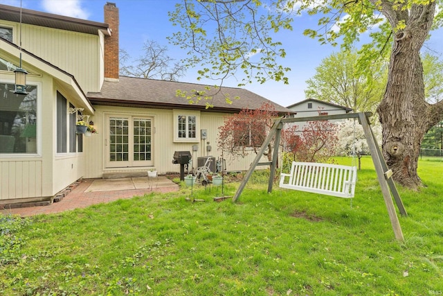 view of grassy yard with a patio