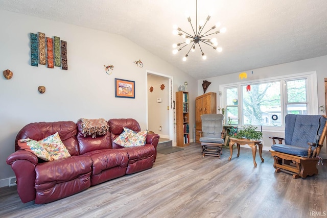 4346 N Centennial Dr, Bloomington, IN 47404 - living area featuring a chandelier, wood finished floors, vaulted ceiling, baseboards, and a textured ceiling