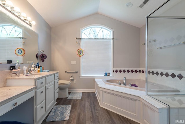 4346 N Centennial Dr, Bloomington, IN 47404 - full bath featuring vaulted ceiling, toilet, wood finished floors, a bath, and vanity