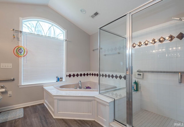 4346 N Centennial Dr, Bloomington, IN 47404 - bathroom featuring vaulted ceiling, a shower stall, wood finished floors, and a bath