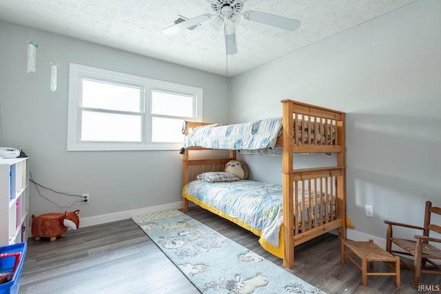 4346 N Centennial Dr, Bloomington, IN 47404 - bedroom with a textured ceiling, baseboards, wood finished floors, and ceiling fan