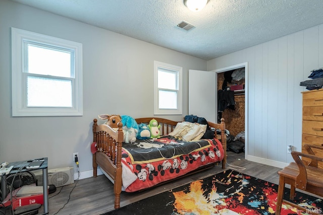 4346 N Centennial Dr, Bloomington, IN 47404 - bedroom featuring wood finished floors, baseboards, and a textured ceiling
