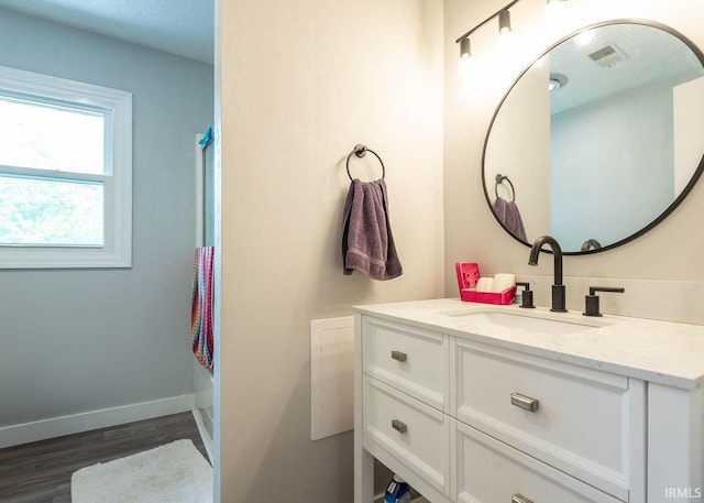 4346 N Centennial Dr, Bloomington, IN 47404 - bathroom with wood finished floors, vanity, and baseboards