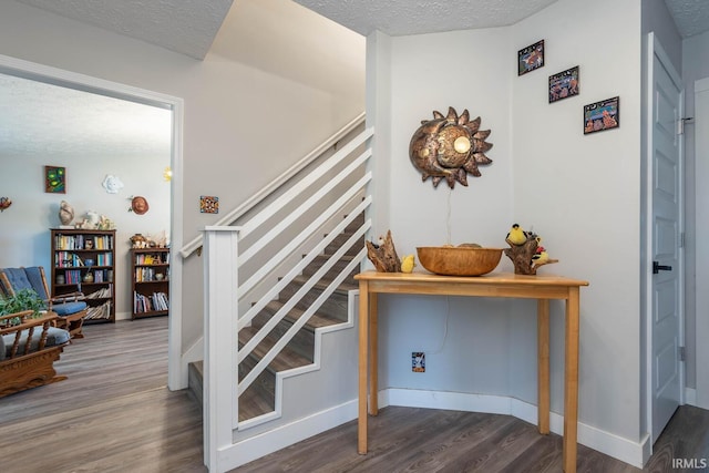 4346 N Centennial Dr, Bloomington, IN 47404 - staircase with wood finished floors, a textured ceiling, and baseboards