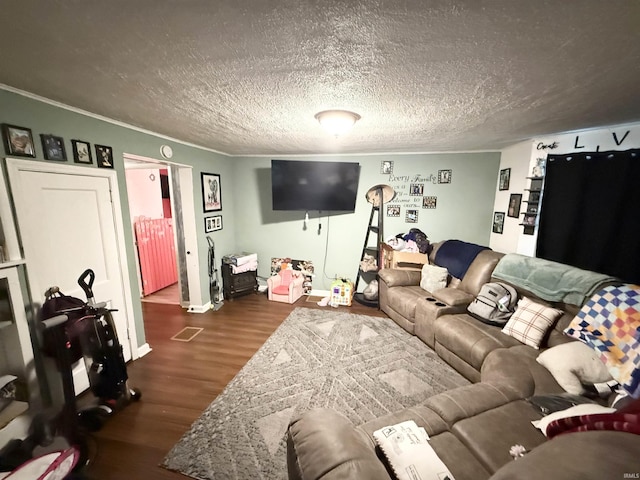 living area with ornamental molding, dark wood-type flooring, and baseboards
