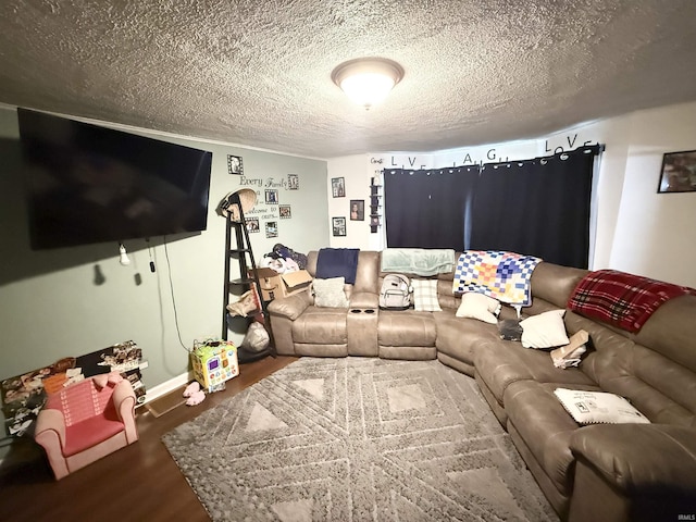 living area with wood finished floors and a textured ceiling