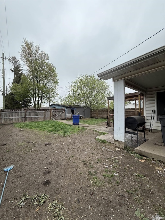 fenced backyard with a patio area