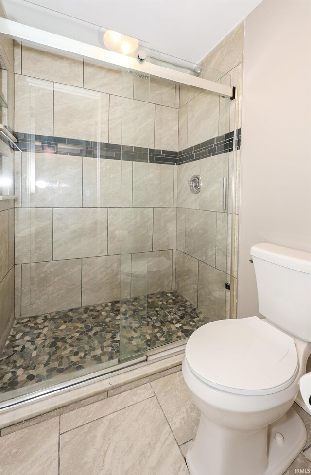 7001 Sweet Gum Ct, Fort Wayne, IN 46804 - full bathroom with toilet, a shower stall, and tile patterned floors