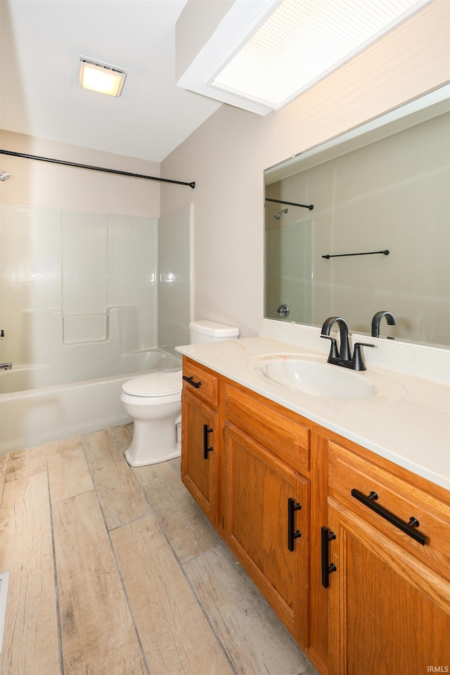 7001 Sweet Gum Ct, Fort Wayne, IN 46804 - bathroom with toilet, bathtub / shower combination, vanity, and wood finished floors