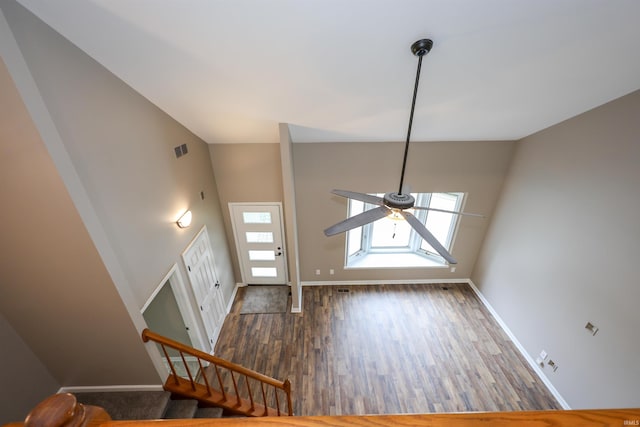 7001 Sweet Gum Ct, Fort Wayne, IN 46804 - entrance foyer featuring baseboards, wood finished floors, ceiling fan, stairway, and high vaulted ceiling