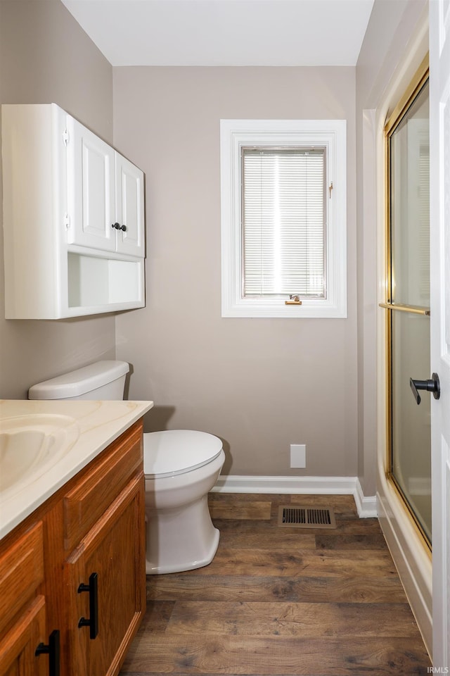 7001 Sweet Gum Ct, Fort Wayne, IN 46804 - bathroom featuring a shower with door, toilet, vanity, and baseboards