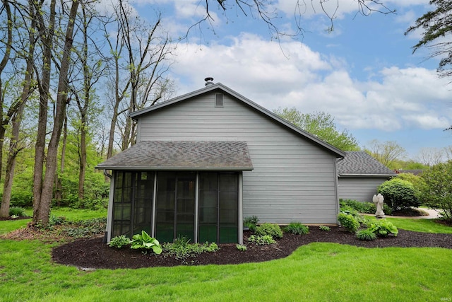 7001 Sweet Gum Ct, Fort Wayne, IN 46804 - back of property featuring a sunroom, roof with shingles, and a lawn