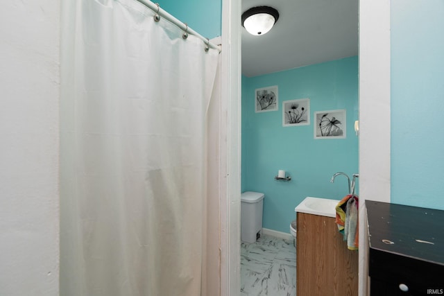 full bathroom with toilet, vanity, marble finish floors, and a shower with shower curtain