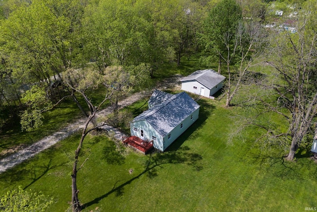 aerial view of property and surrounding area with a forest