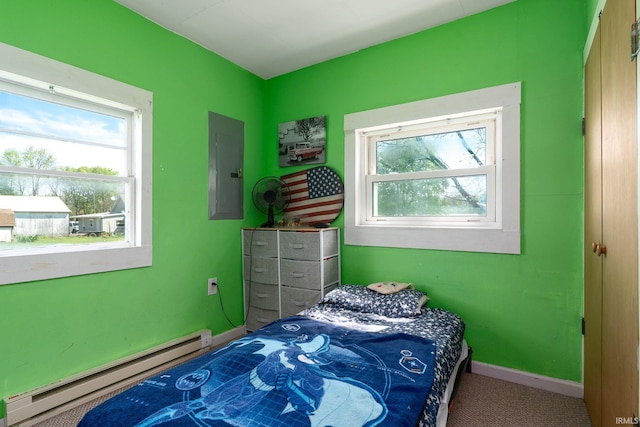 carpeted bedroom featuring a baseboard radiator, electric panel, multiple windows, and baseboards