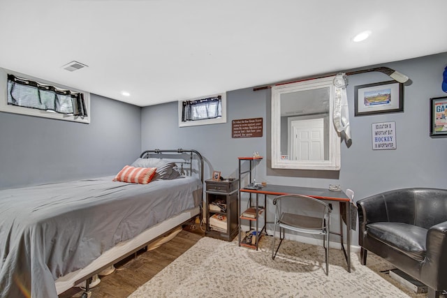 bedroom with wood finished floors