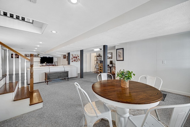 dining room featuring carpet, recessed lighting, and stairway