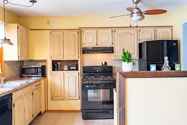 kitchen featuring black appliances, under cabinet range hood, a sink, ceiling fan, and light tile patterned floors
