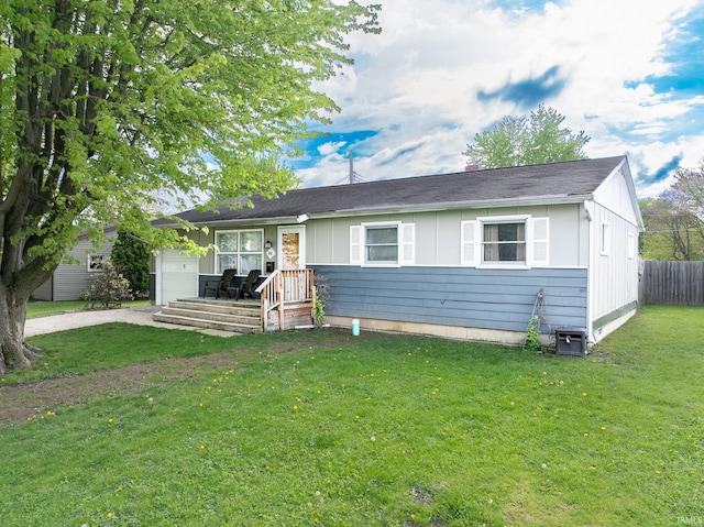 single story home with driveway, board and batten siding, and a garage