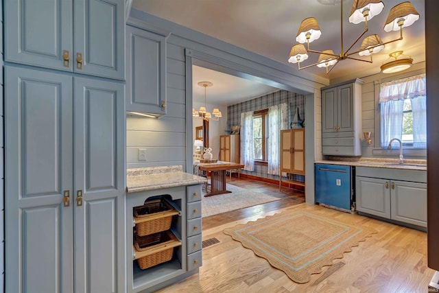489 S Lincoln St, Orleans, IN 47452 - kitchen with a chandelier, dishwasher, gray cabinetry, light wood finished floors, and wallpapered walls