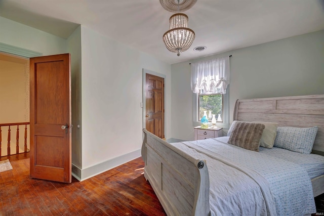 489 S Lincoln St, Orleans, IN 47452 - bedroom with a chandelier and dark wood-style flooring