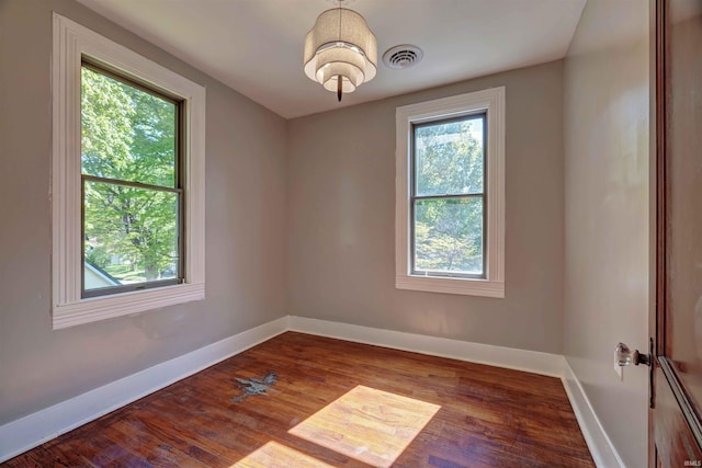 489 S Lincoln St, Orleans, IN 47452 - unfurnished room with baseboards and wood finished floors