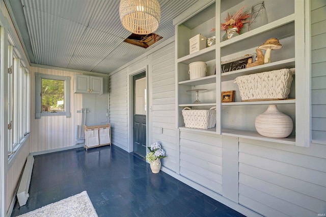 489 S Lincoln St, Orleans, IN 47452 - unfurnished sunroom featuring baseboard heating and a chandelier