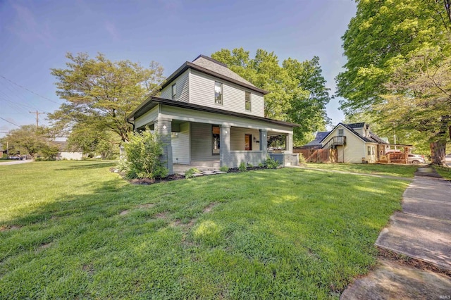 489 S Lincoln St, Orleans, IN 47452 - view of front of house with a porch and a front yard