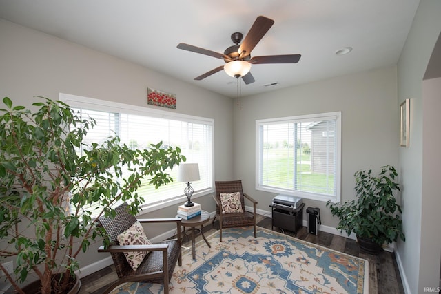 living area featuring wood finished floors, baseboards, a ceiling fan, and recessed lighting