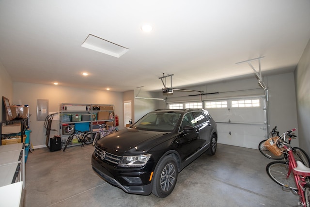 garage featuring a garage door opener and electric panel