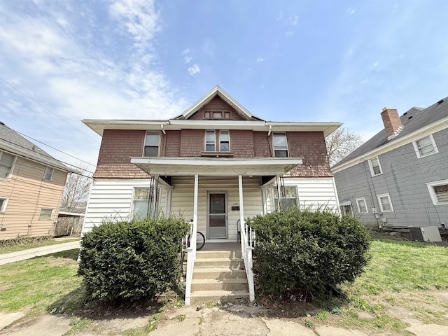 118 13th St, Logansport, IN 46947 - view of front of house with covered porch and central air condition unit