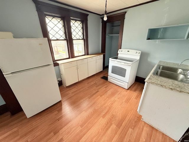 118 13th St, Logansport, IN 46947 - kitchen featuring white appliances, a sink, open shelves, white cabinets, and light countertops