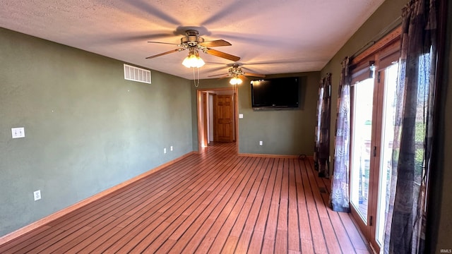 9081 N 725 E, Otterbein, IN 47970 - unfurnished room with ceiling fan, baseboards, and light wood-style floors