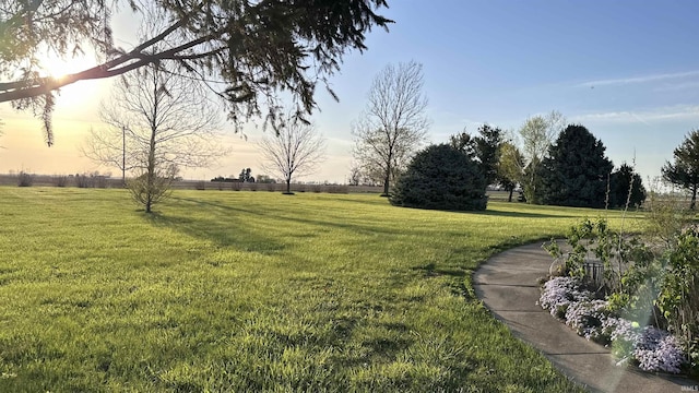 9081 N 725 E, Otterbein, IN 47970 - yard at dusk featuring a lawn
