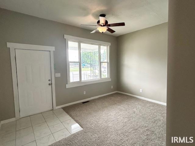 1023 W Franklin St, Evansville, IN 47710 - entrance foyer featuring a ceiling fan, light carpet, and baseboards