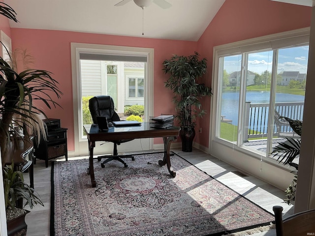 12217 Harvest Bay Dr, Fort Wayne, IN 46845 - office space with lofted ceiling, ceiling fan, a water view, wood finished floors, and baseboards