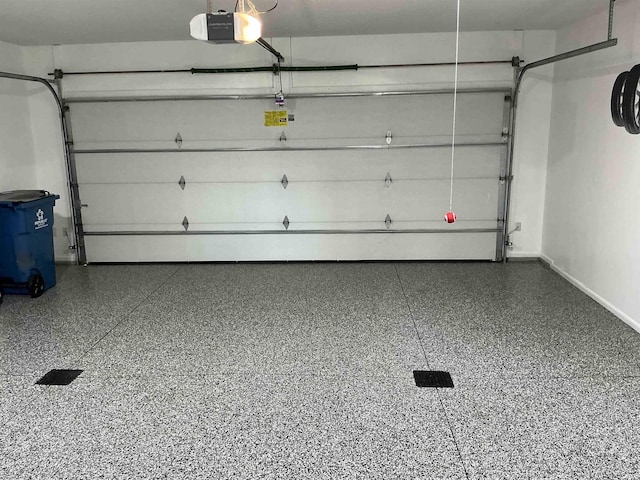 12217 Harvest Bay Dr, Fort Wayne, IN 46845 - garage with a garage door opener and baseboards