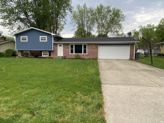 split level home featuring an attached garage, a front lawn, driveway, and brick siding