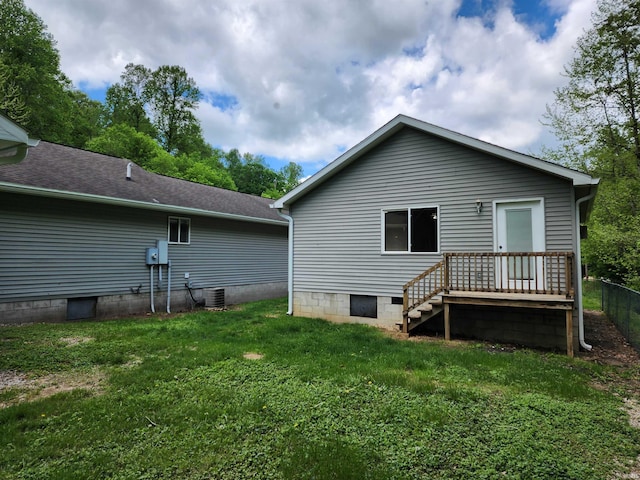 back of property featuring a lawn and central AC unit