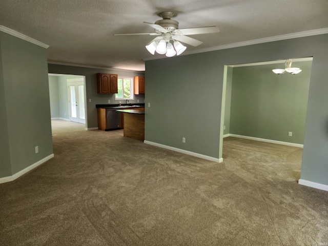 kitchen with crown molding, dark countertops, dishwasher, carpet floors, and ceiling fan