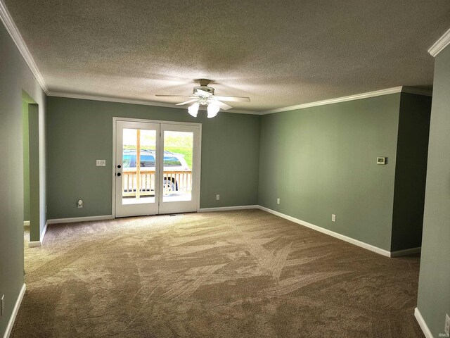 spare room featuring a ceiling fan, ornamental molding, carpet flooring, a textured ceiling, and baseboards