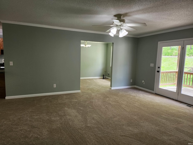 carpeted spare room with a ceiling fan, ornamental molding, a textured ceiling, baseboards, and a chandelier
