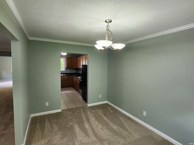 unfurnished dining area featuring light carpet, crown molding, a textured ceiling, baseboards, and a chandelier