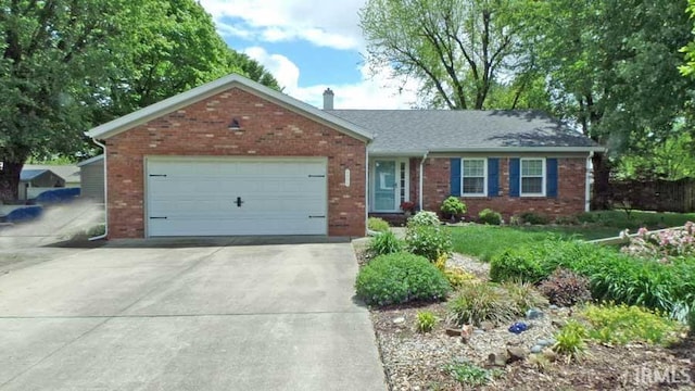 ranch-style house with brick siding, driveway, and a garage